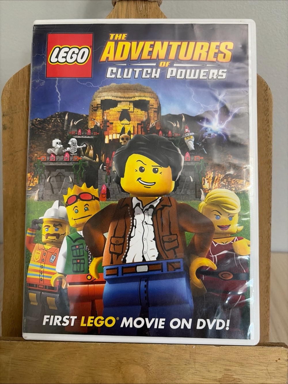 LEGO The Adventures of Clutch Powers DVD Cover - Yellow, Blue, Brown, Black